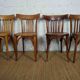 4 mismatched signed bistro chairs