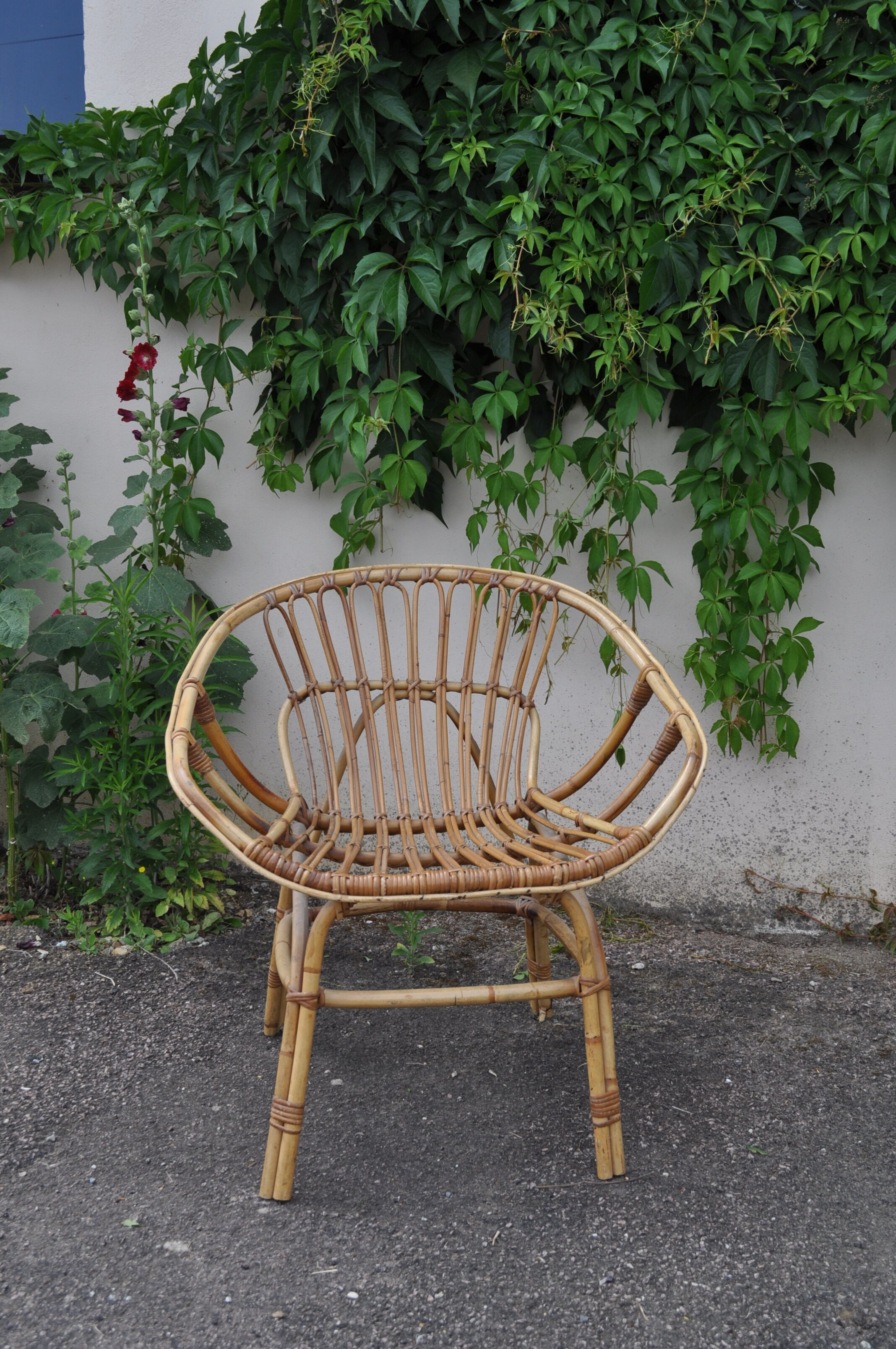 Rattan basket armchair.