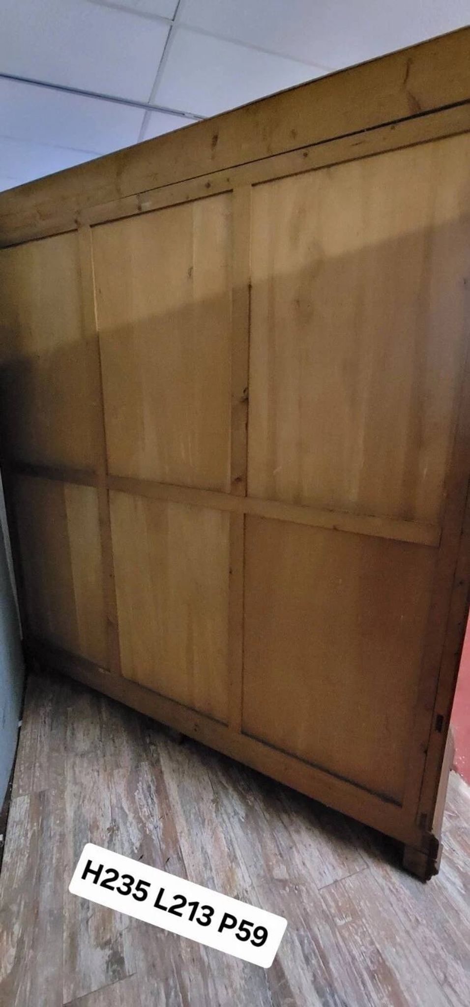 Large pine bookcase with three doors, fitted with frosted glass.