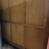 Large pine bookcase with three doors, fitted with frosted glass.