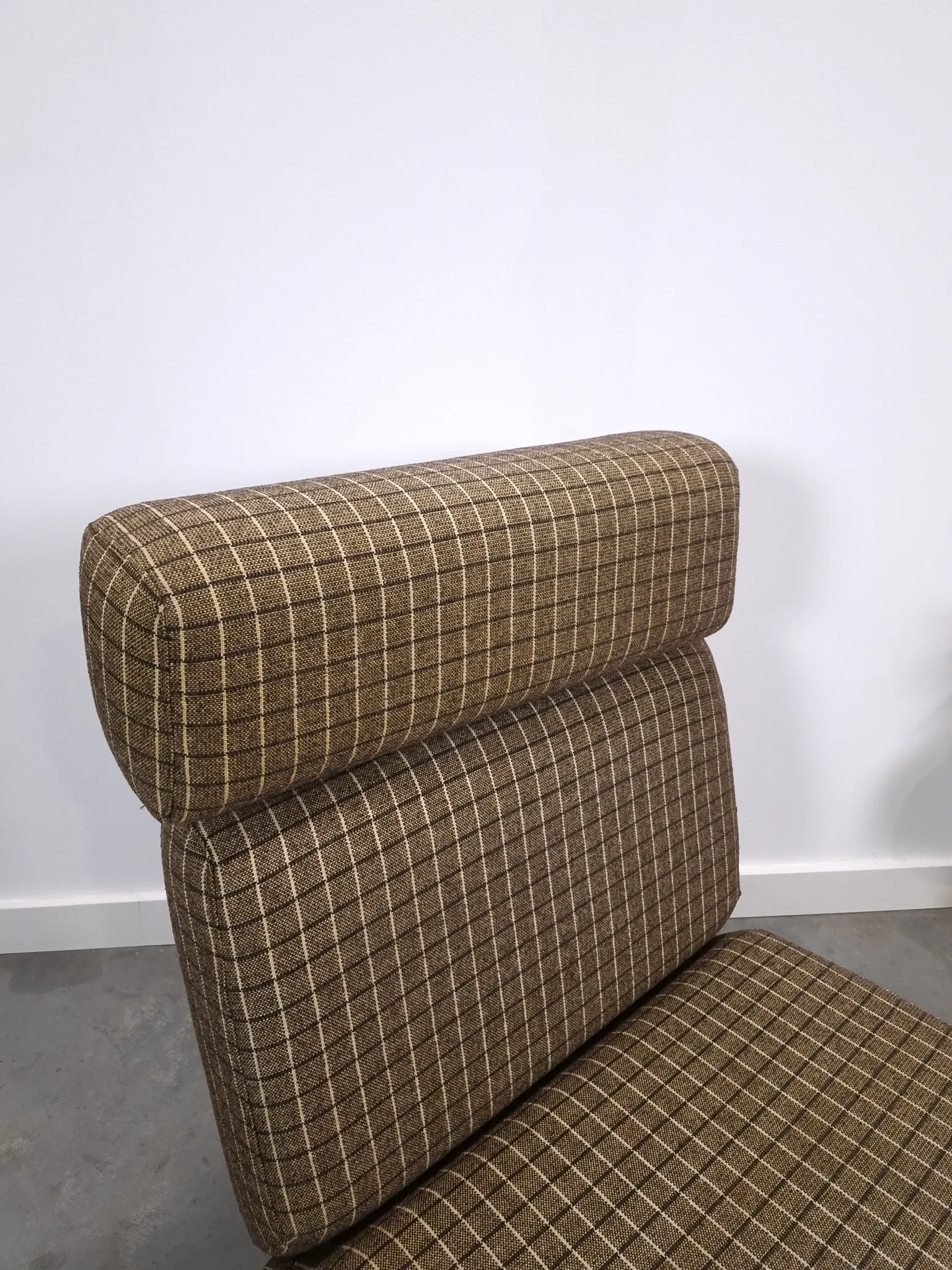 Vintage pull-out sofa bed, brown checked lounge chair with chrome.