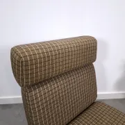 Vintage pull-out sofa bed, brown checked lounge chair with chrome.