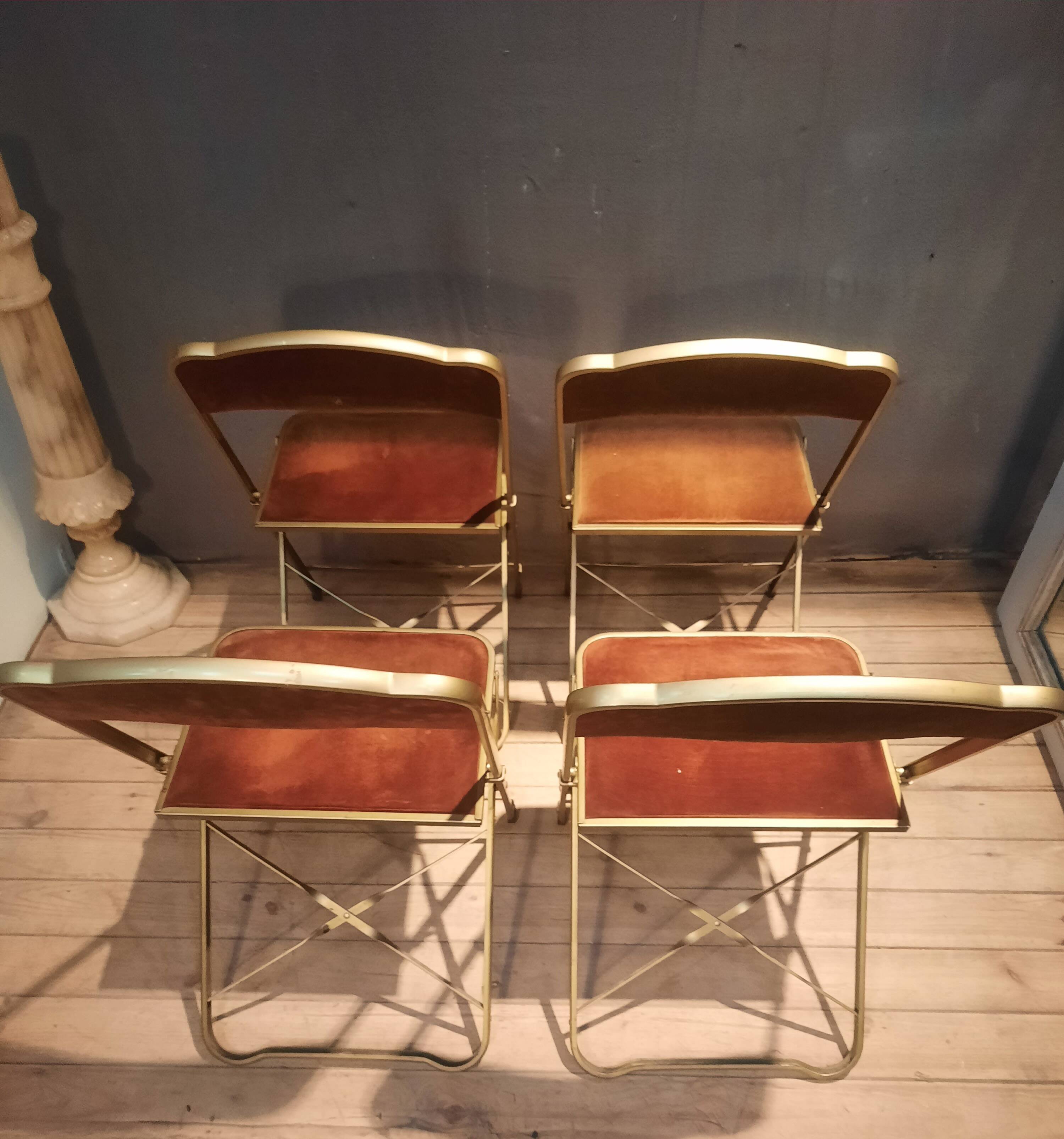 Set of four folding metal and velvet chairs