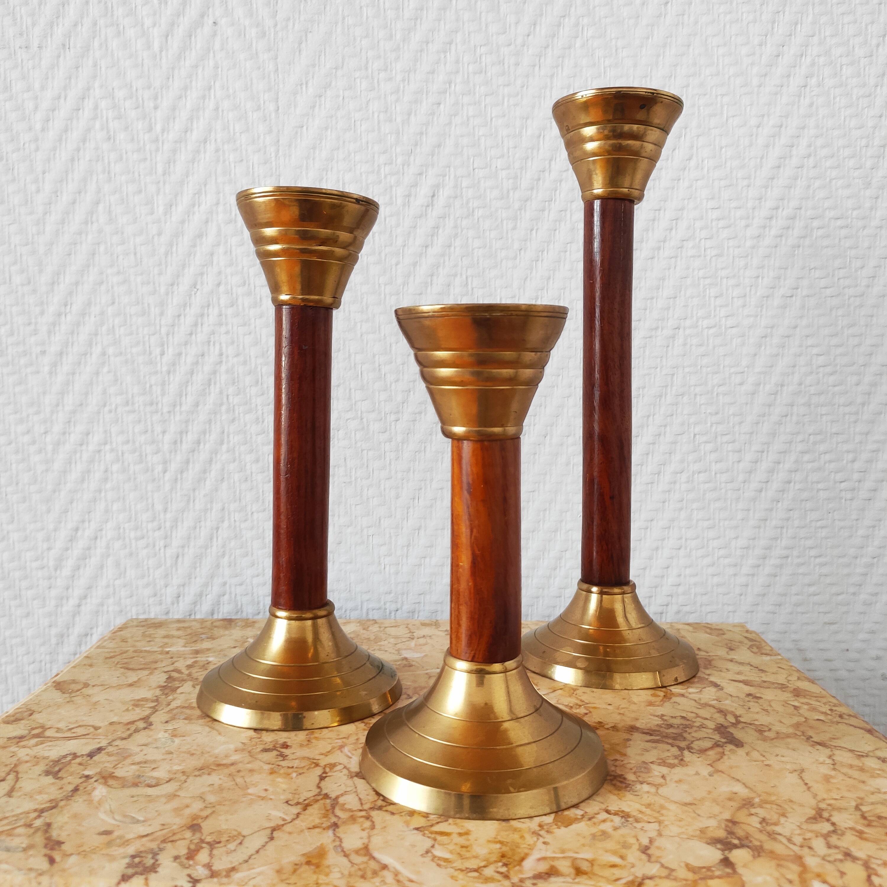 Set of three vintage wooden and brass candlesticks