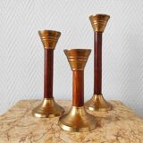 Set of three vintage wooden and brass candlesticks