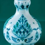 Royal Delft blue-green ceramic table lamp with pink jacquard peacock shade.