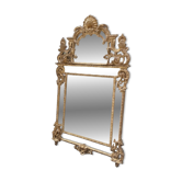 Regency style mirror in gilded wood, first half of the 19th century.