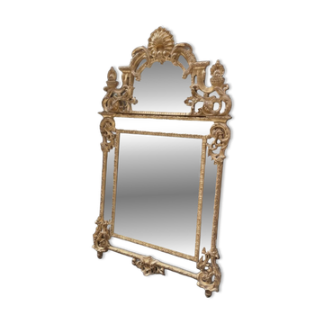Regency style mirror in gilded wood, first half of the 19th century.