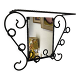Wall-mounted coat rack with its mirror.