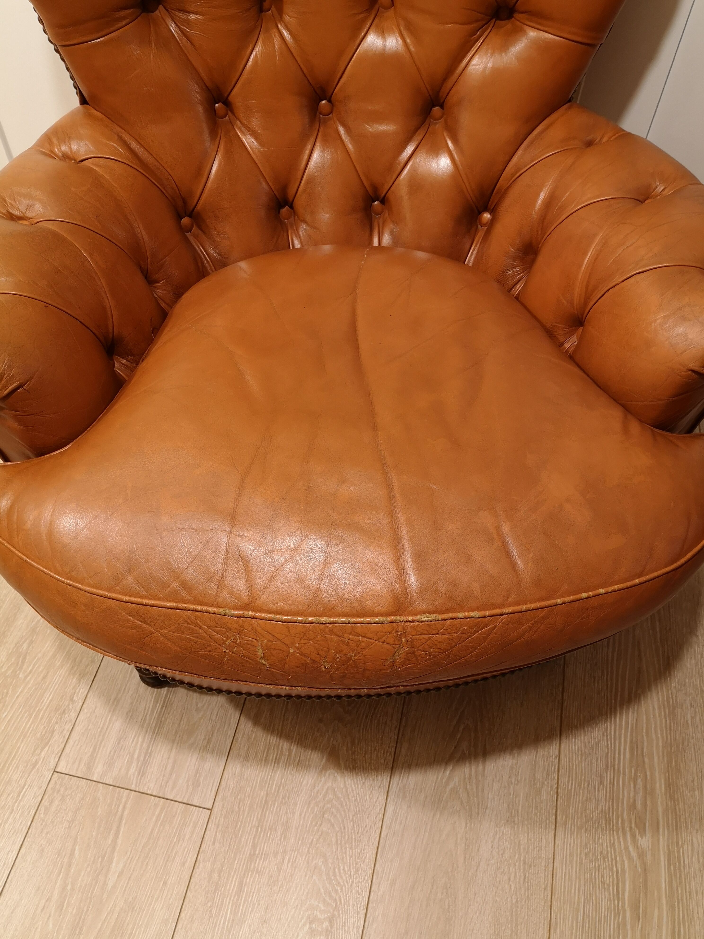 Pair of leather chesterfield chairs