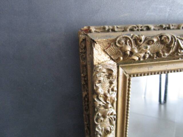 Antique mirror in wood and gilded stucco