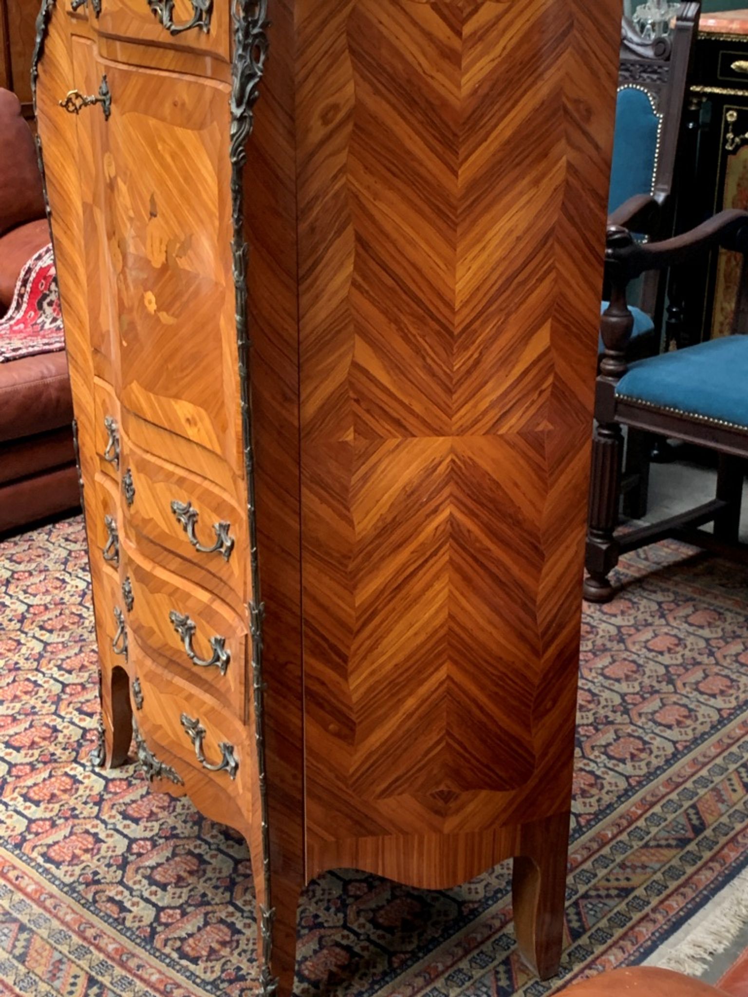 Old French secretary in bronze and wood marquetry.