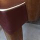 Skai chair binds wine and wooden footpieces and armrests