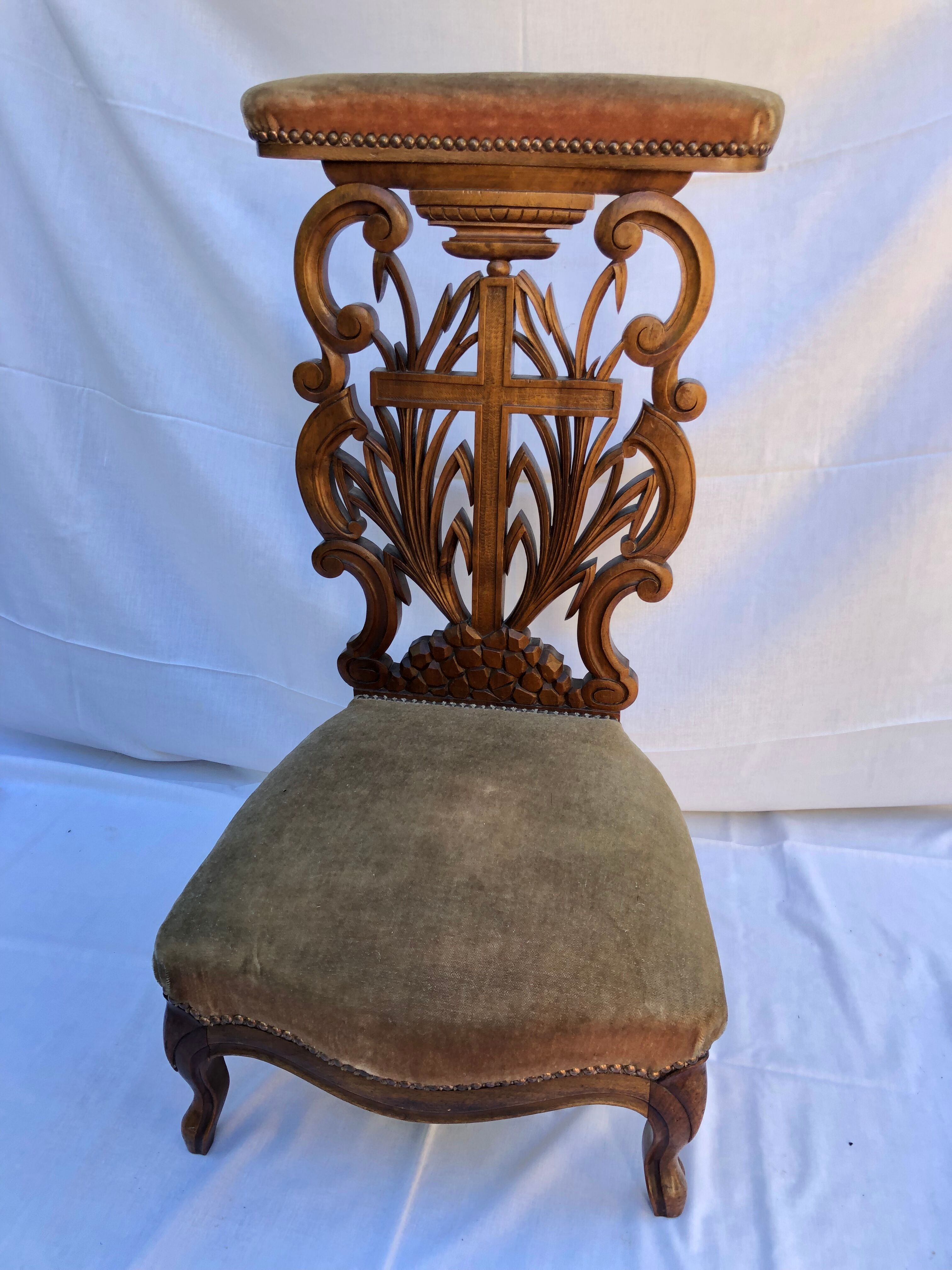 Low armchair in carved wood
