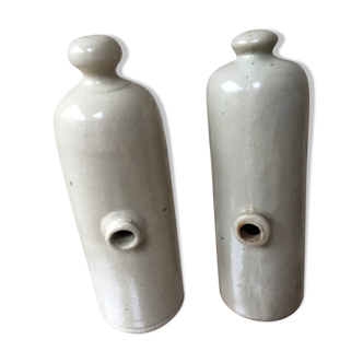 Lot of two old bottles of beige enamelled sandstone bottles
