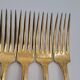 12 Table Forks in gold metal
