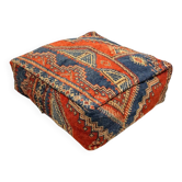 Pouf berbère vintage en laine – Motifs géométriques terracotta et bleu