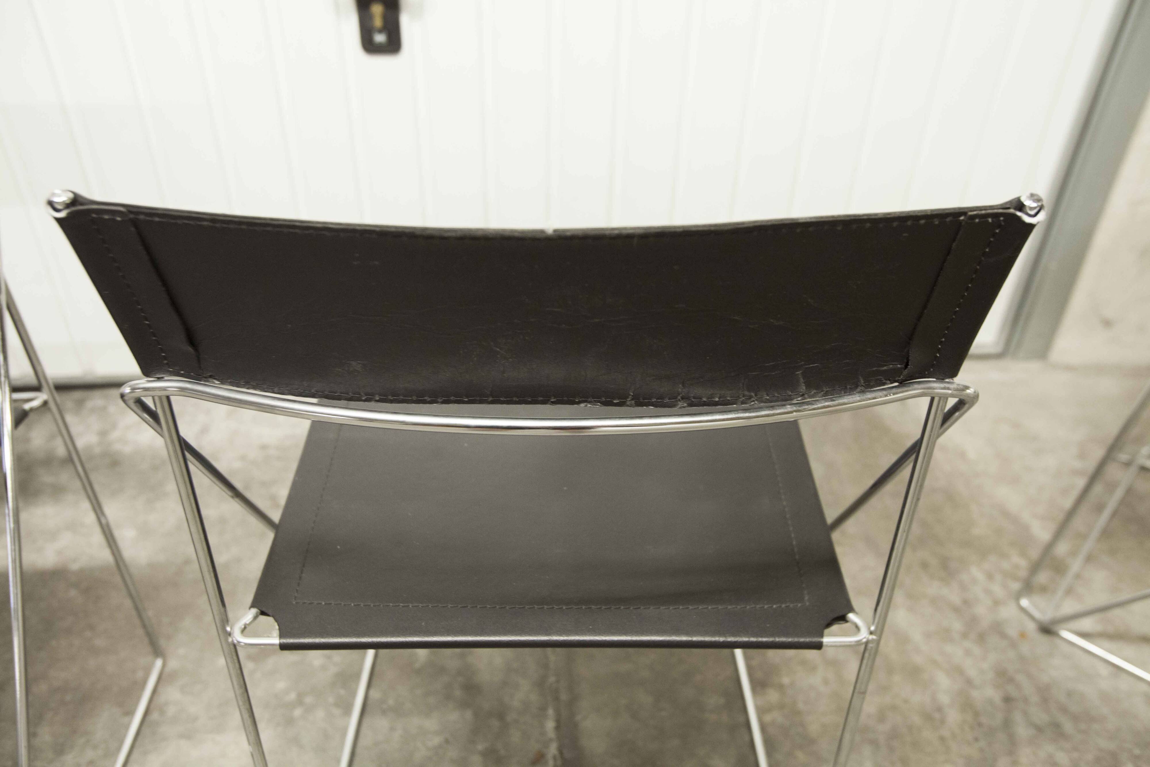 Set of 3 minimalist X line chairs by Niels Jorgen Haugesen.