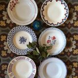 Six soup plates don't match in red and blue.