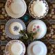 Six soup plates don't match in red and blue.