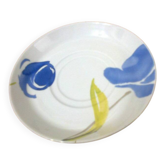 white saucer, blue and green floral pattern