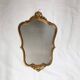 Miroir doré en bois