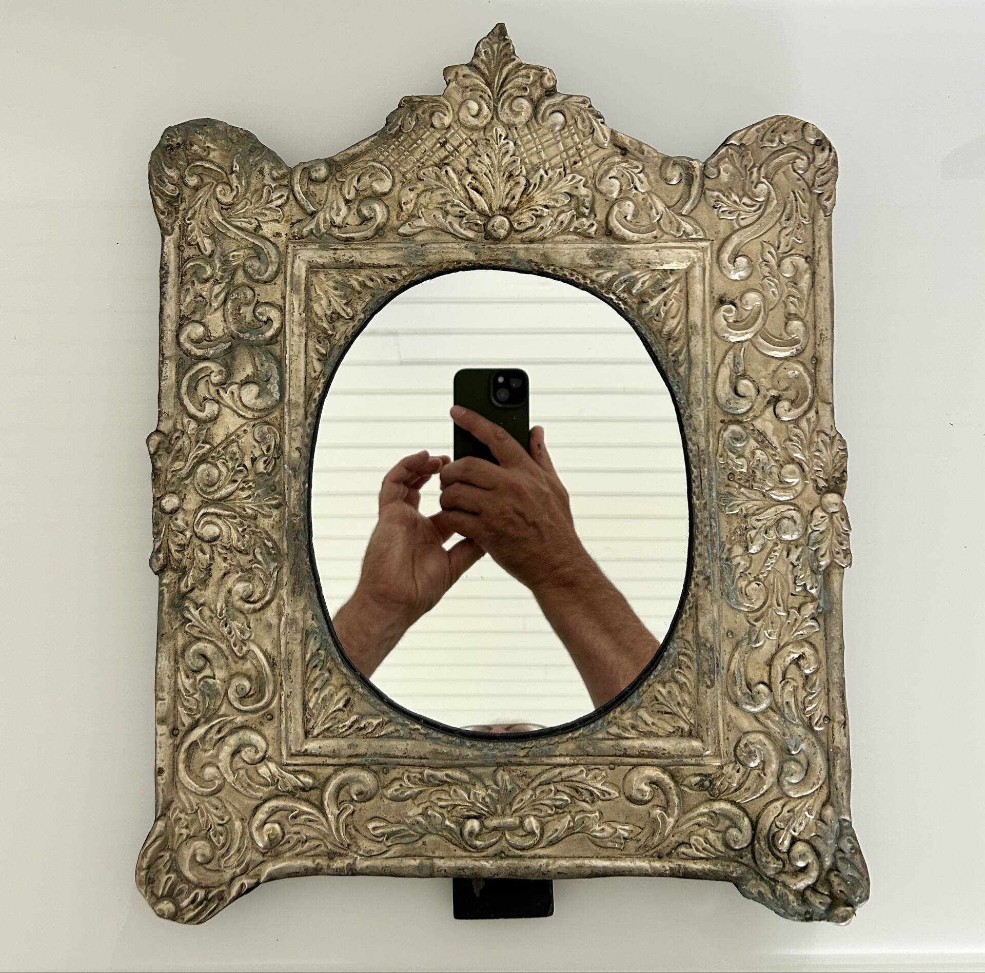Baroque mirror in repoussé brass