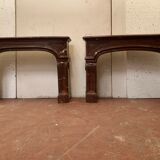 Pair of Louis XIV style fireplaces in red cherry marble. XIX century.