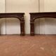 Pair of Louis XIV style fireplaces in red cherry marble. XIX century.