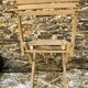 Antique folding chair with wooden slats