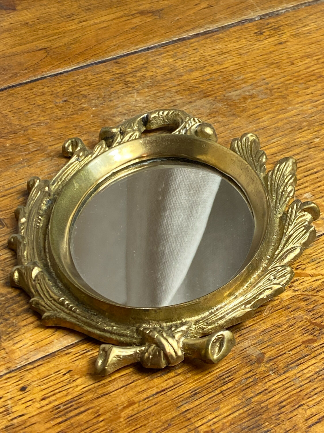 Small antique bronze mirror