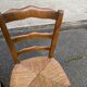 2 solid oak carved and rush-seated chairs in the Louis Philippe style, 19th century.