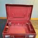 Red leather suitcase