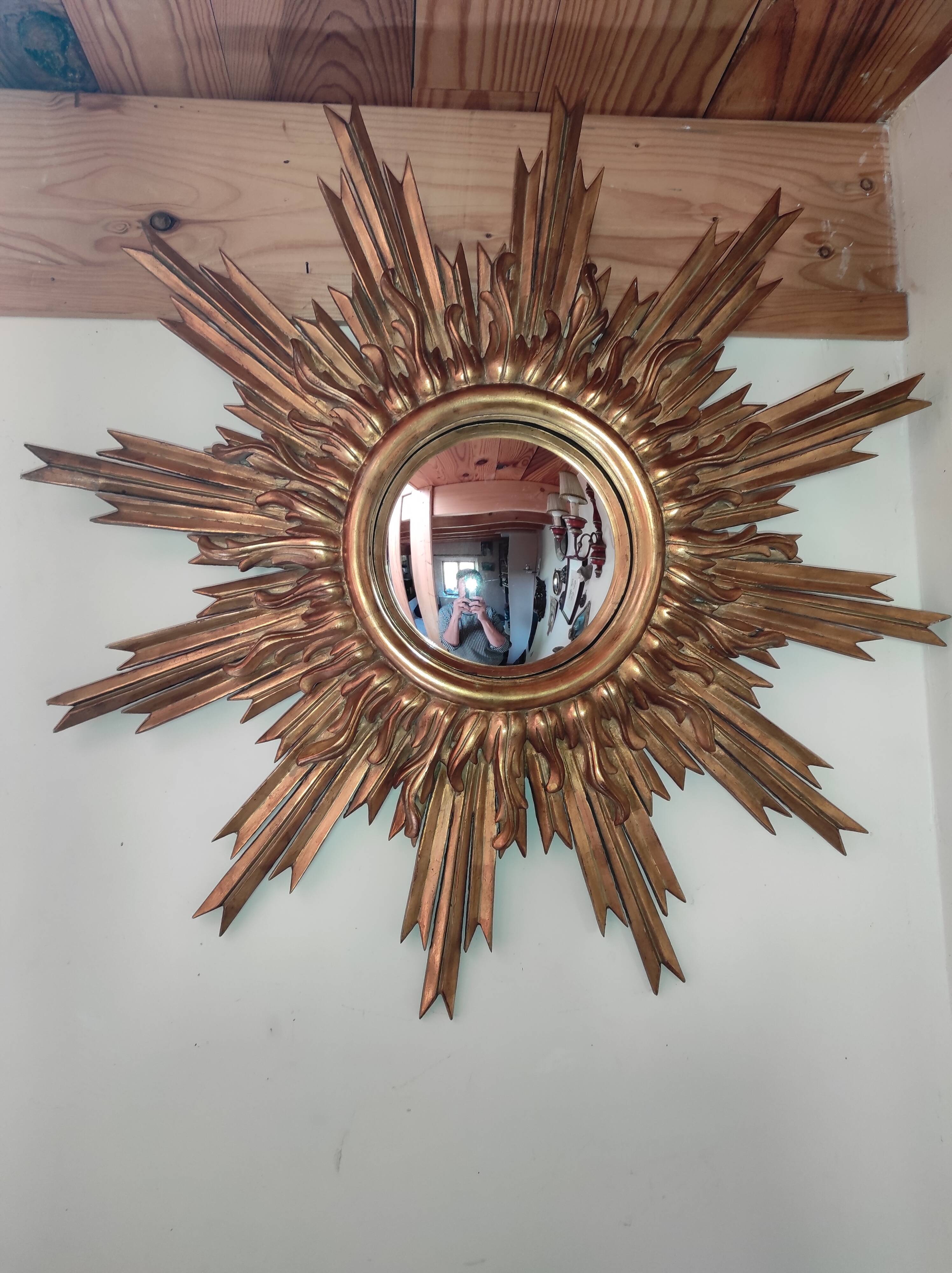 Sun mirror and witch's eye in gilded wood