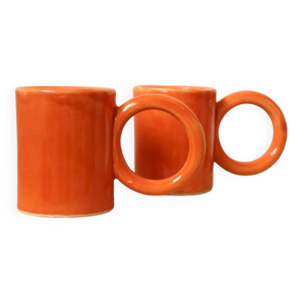 Handmade orange peach ceramic coffee mug set with large circular handles
