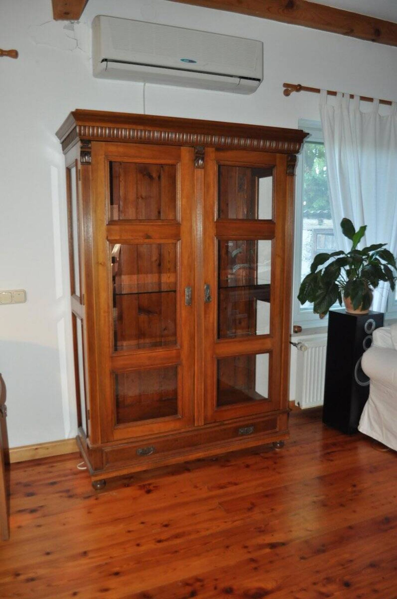 Antique wooden and glass cabinet in brown - 1900 style display case with carved mouldings.
