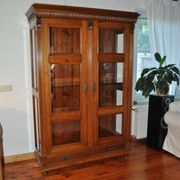 Antique wooden and glass cabinet in brown - 1900 style display case with carved mouldings.