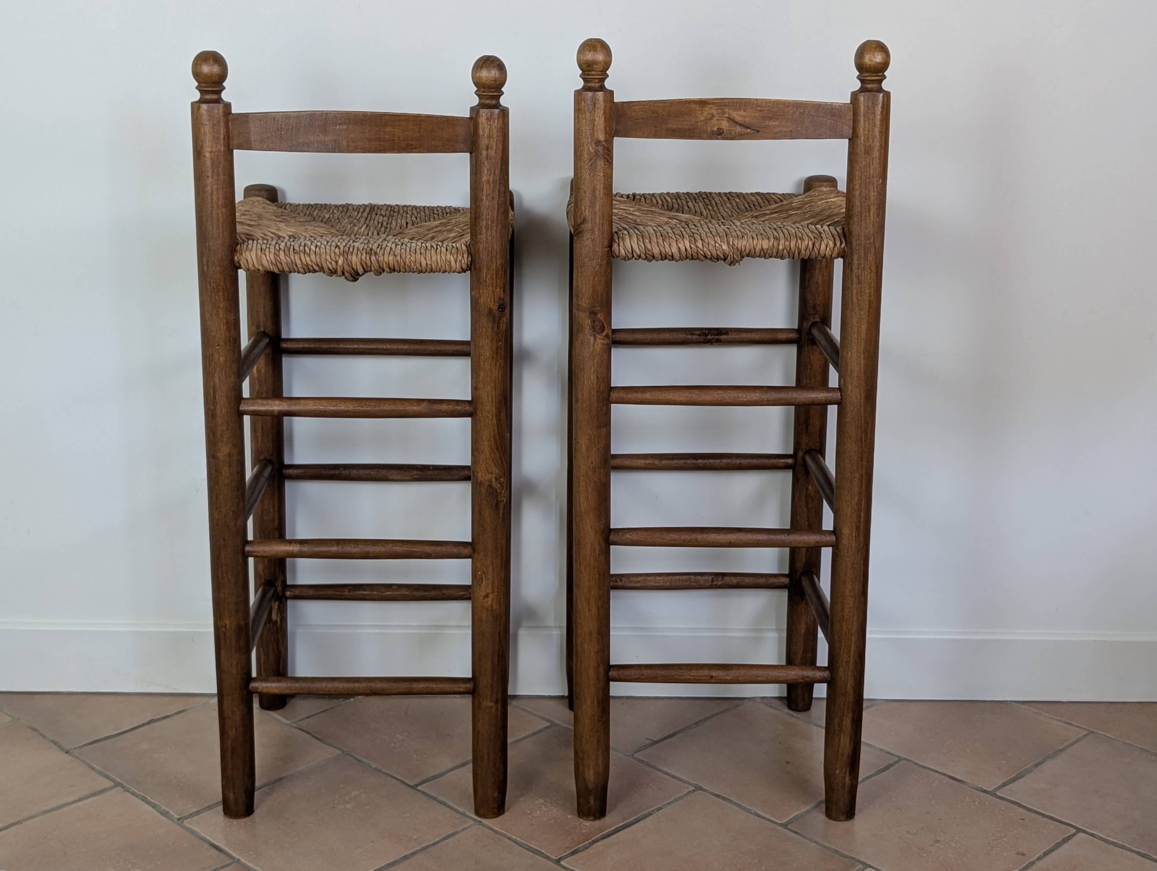 High wooden and straw stools