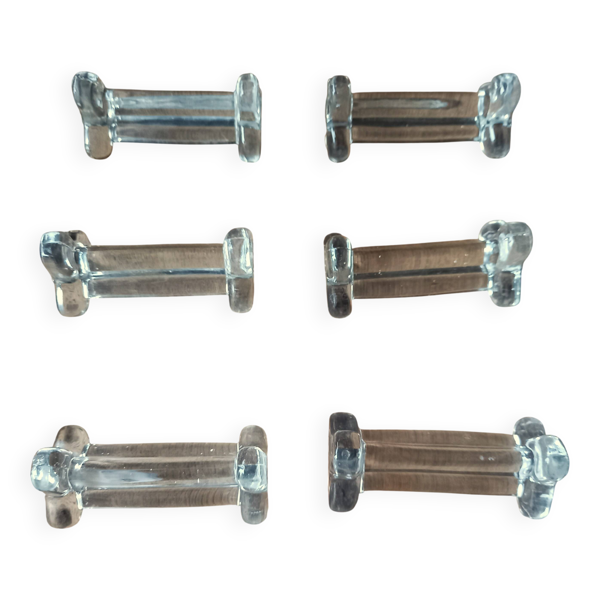 A set of 6 antique transparent trilobed glass knife holders