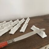 Vintage knife holders of 12, in white wave-shaped porcelain
