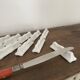 Vintage knife holders of 12, in white wave-shaped porcelain