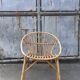 Vintage 1960s rattan shell chair – an icon of bohemian design.