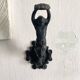 Antique cast iron coat hook with swimmer and shell basin.