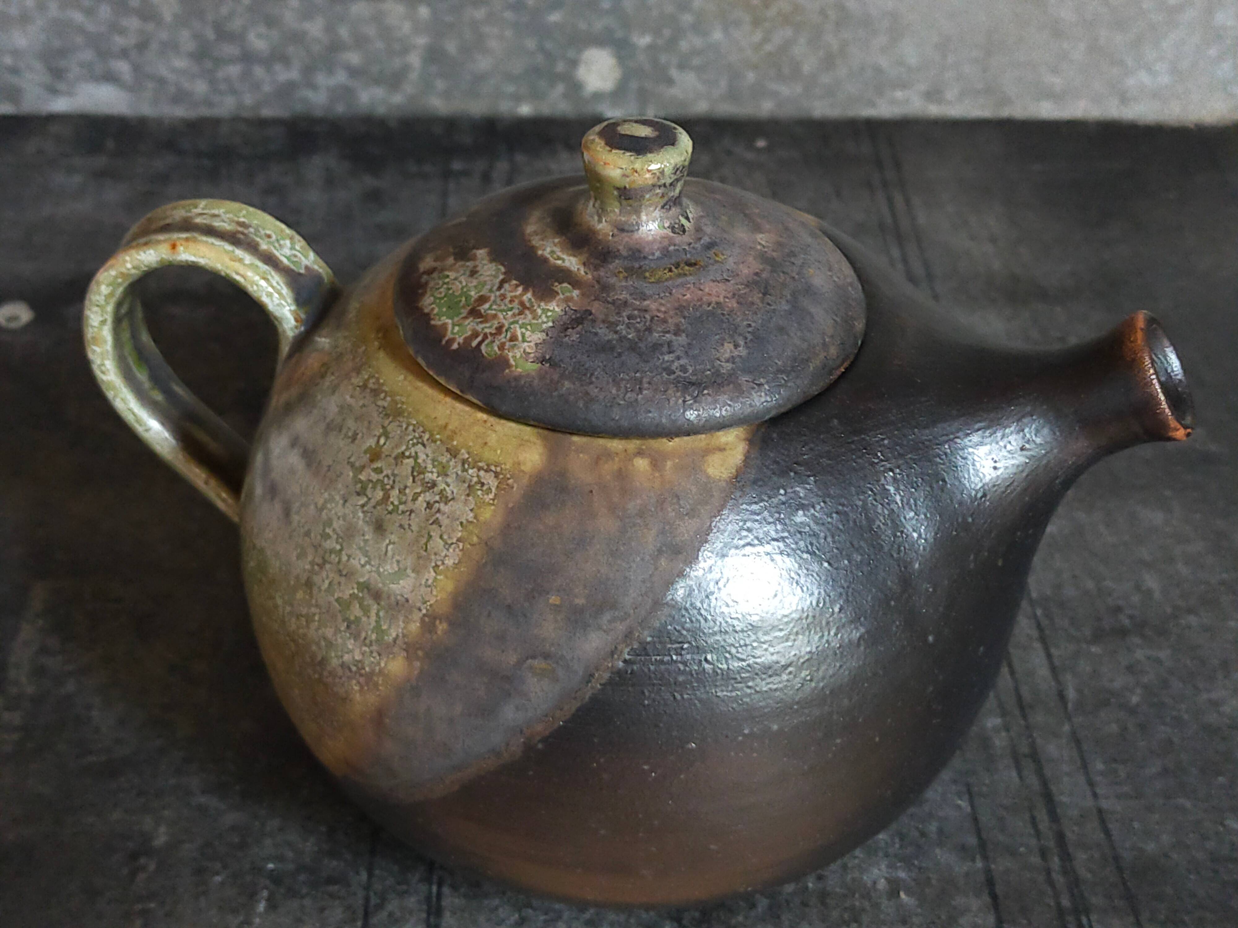 Vintage enameled stoneware potter's teapot