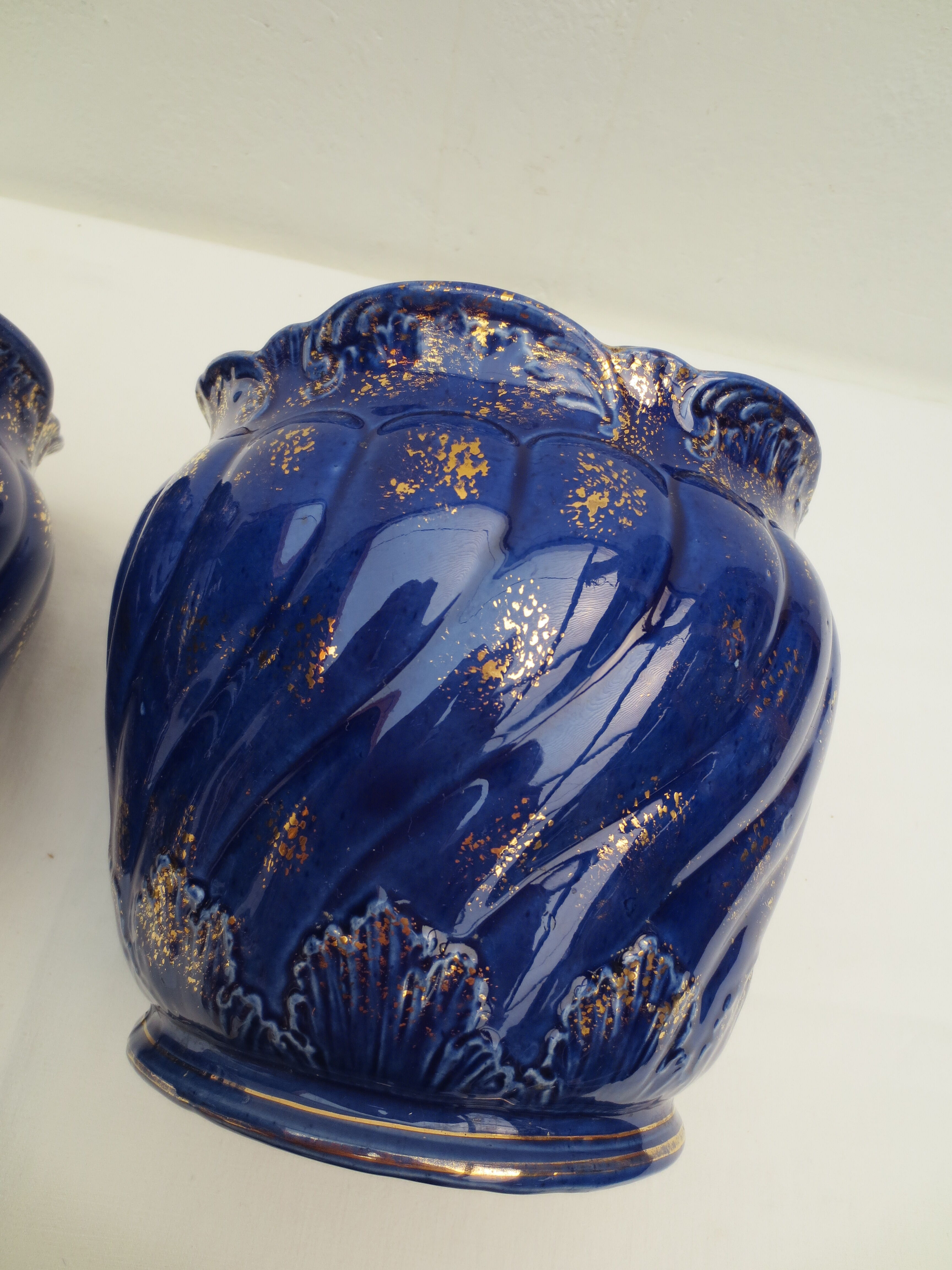 Pair of cache-old pots in midnight blue and gold ceramic