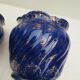 Pair of cache-old pots in midnight blue and gold ceramic