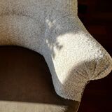 Pair of beige bouclette fabric frog chairs and their footrest.