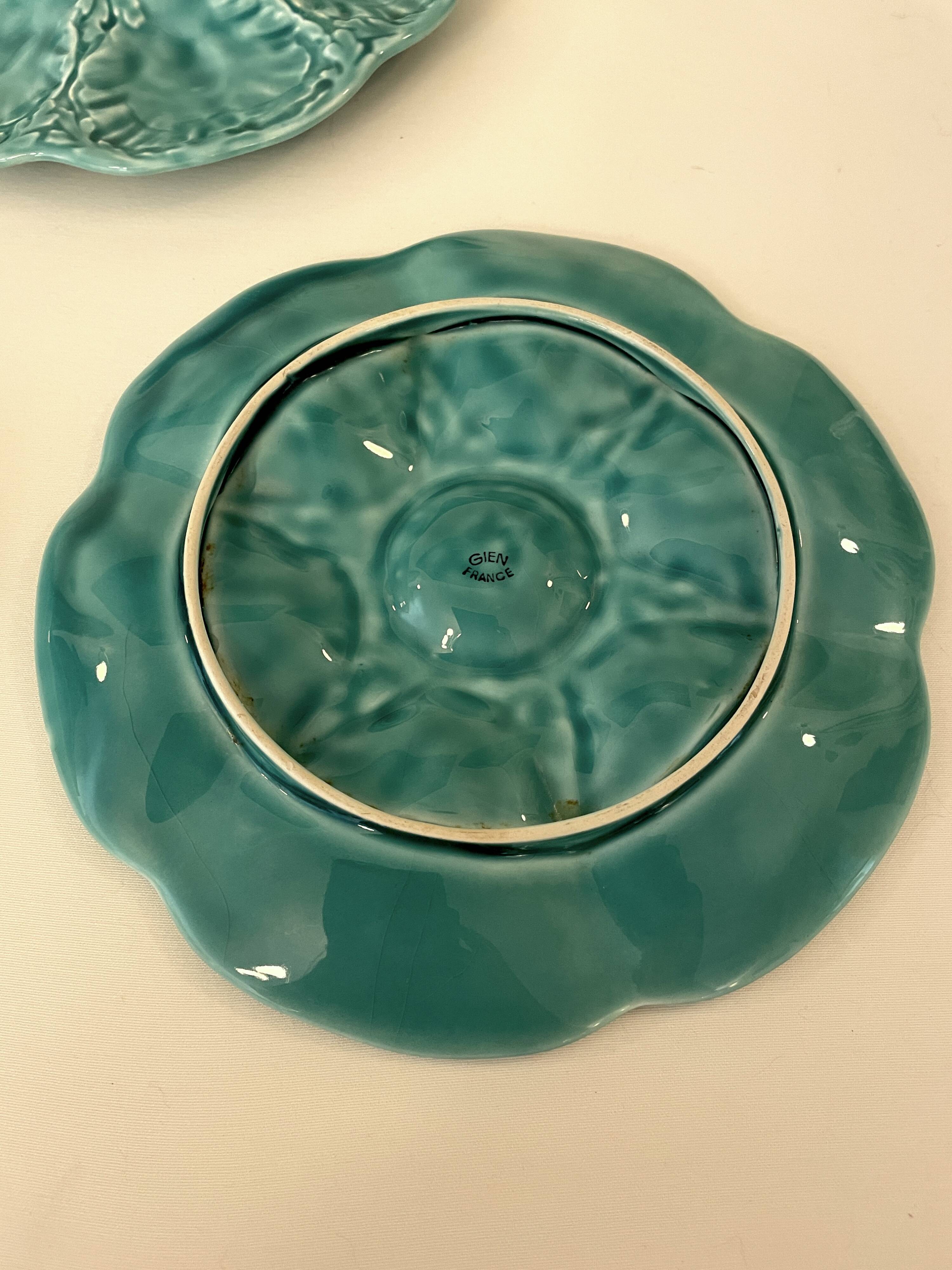 Dish and 4 turquoise faience oyster plates from Gien, France.