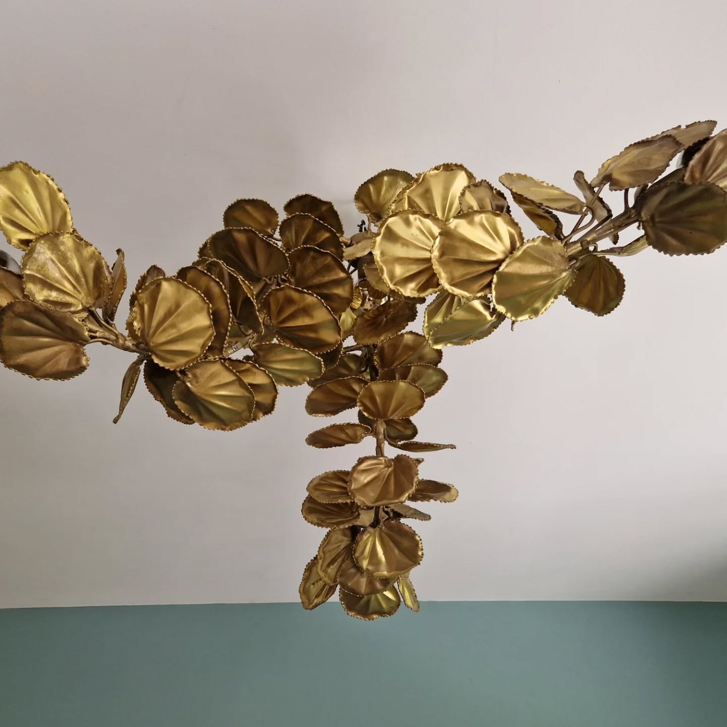Large brutalist brass chandelier with floral decoration, 1970s.