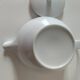 Graphic teapot in white porcelain with a minimalist design.